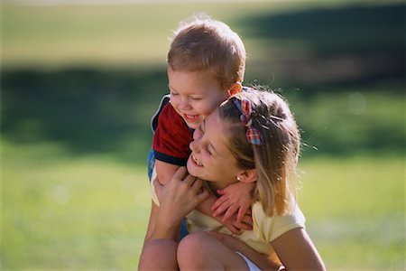 sister hugs baby - Girl and Boy Embracing Outdoors Stock Photo - Rights-Managed, Code: 700-00079069