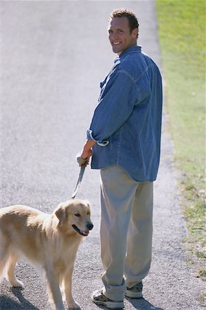 dog summer back - Portrait of Man Walking Dog on Path Stock Photo - Rights-Managed, Code: 700-00079098