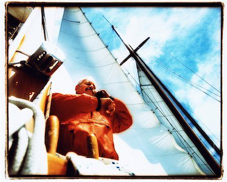 simsearch:700-00424633,k - Mature Man on Sailboat, Using Cell Phone, Checking Watch Stock Photo - Rights-Managed, Code: 700-00079119