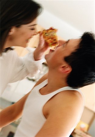 pizza couple - Woman Feeding Man Slice of Pizza Stock Photo - Rights-Managed, Code: 700-00079412