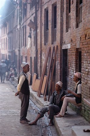 Newar hommes prenant la pause de travail Bhaktapur, Kathmandu, Népal Photographie de stock - Rights-Managed, Code: 700-00079562