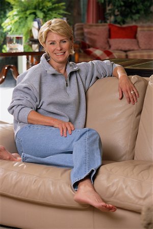 Portrait of Mature Woman Sitting On Sofa Stock Photo - Rights-Managed, Code: 700-00079638