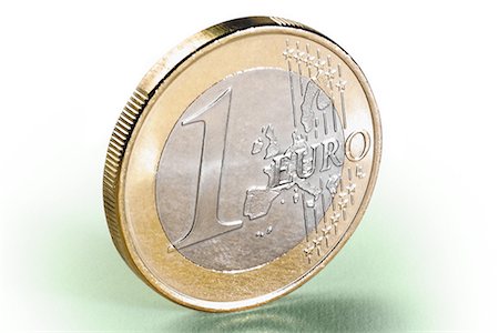 Gros plan d'une pièce d'un Euro debout sur le bord Photographie de stock - Rights-Managed, Code: 700-00079899
