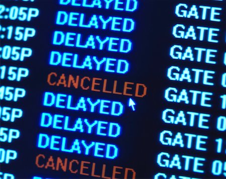 Close-Up of Flight Message Board With Cancelled Sign Stock Photo - Rights-Managed, Code: 700-00070584