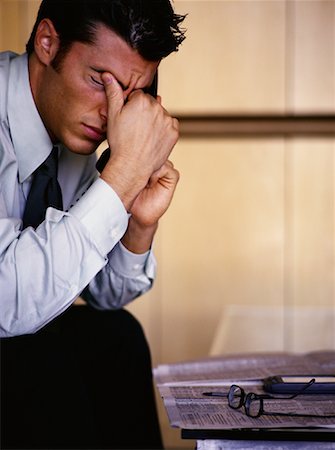 simsearch:700-00695821,k - Tired Businessman Using Phone Rubbing Eyes Stock Photo - Rights-Managed, Code: 700-00070619