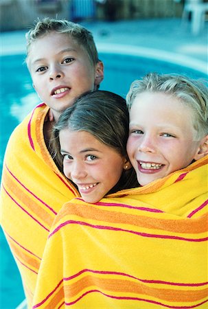 Portrait of Children Wrapped in Towel near Swimming Pool Stock Photo - Rights-Managed, Code: 700-00070743