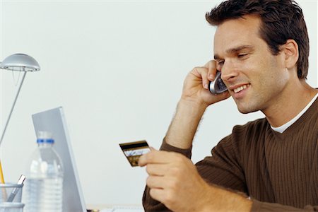 simsearch:700-00280412,k - Man Sitting at Laptop Computer With Credit Card and Phone Stock Photo - Rights-Managed, Code: 700-00070799