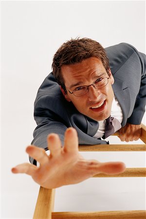 Overhead View of Businessman Climbing Ladder Stock Photo - Rights-Managed, Code: 700-00070839