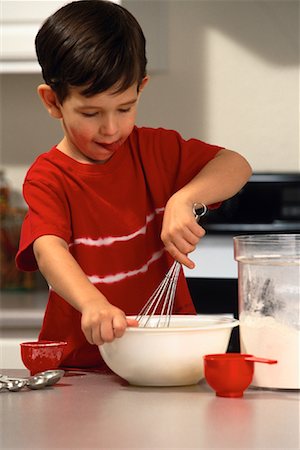 Boy Mixing Ingredients in Bowl For Recipe Stock Photo - Rights-Managed, Code: 700-00070926