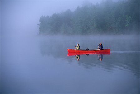 simsearch:600-02348733,k - Couple Canoeing on Lake with Mist Haliburton, Ontario, Canada Stock Photo - Rights-Managed, Code: 700-00071207