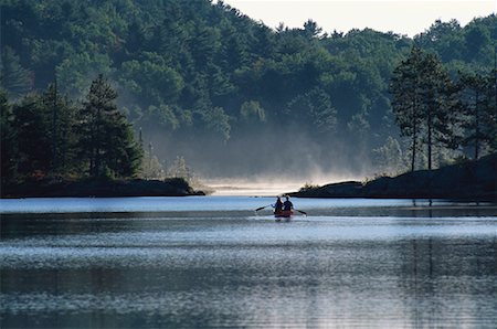 Back View of Couple Canoeing on Lake, Haliburton, Ontario, Canada Stock Photo - Rights-Managed, Code: 700-00071209