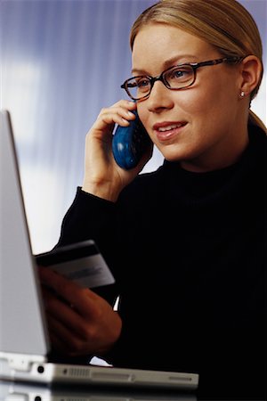 simsearch:700-00522409,k - Woman Using Phone and Laptop Computer, Holding Credit Card Foto de stock - Con derechos protegidos, Código: 700-00071887