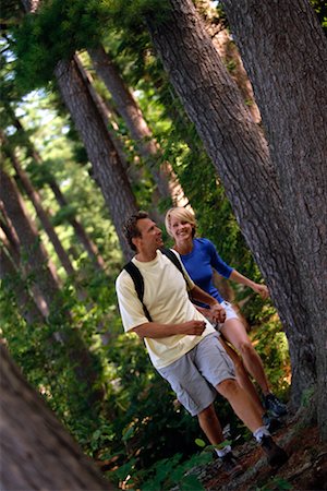 simsearch:700-00071220,k - Couple Holding Hands, Hiking Through Forest Stock Photo - Rights-Managed, Code: 700-00072241