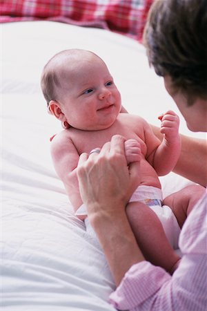 simsearch:700-00074987,k - Mother Playing with Baby on Bed Stock Photo - Rights-Managed, Code: 700-00072532