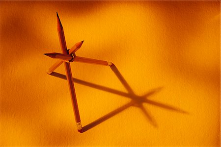 pierre tremblay - Three Pencils Forming Triangular Shape with Shadows Foto de stock - Con derechos protegidos, Código: 700-00072785