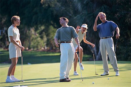 Groupe de gens jouer au golf Photographie de stock - Rights-Managed, Code: 700-00072991