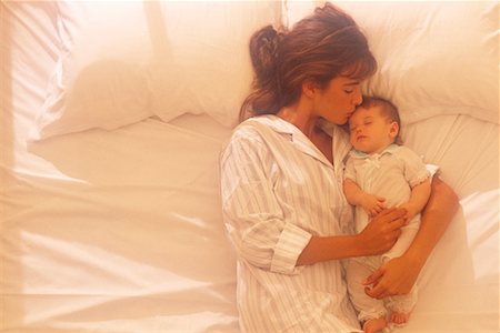 simsearch:700-00074987,k - Mother Lying on Bed with Baby Stock Photo - Rights-Managed, Code: 700-00073036