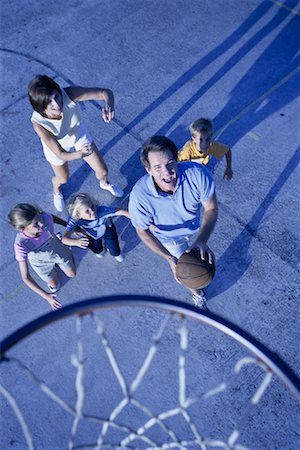 daddy and son playing basketball - Overhead View of Family Playing Basketball Outdoors Stock Photo - Rights-Managed, Code: 700-00073584