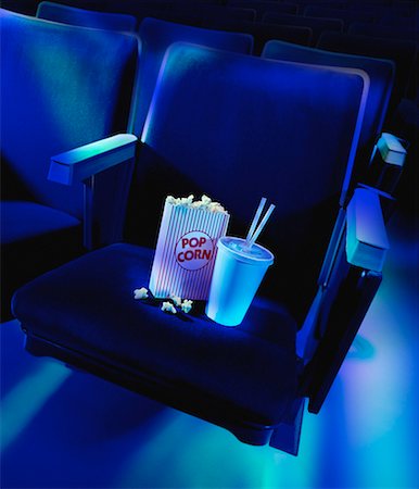 simsearch:632-06118280,k - Soda and Popcorn on Seat in Theatre Stock Photo - Rights-Managed, Code: 700-00084117