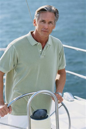 simsearch:700-00365641,k - Portrait of Mature Man at Steering Wheel of Boat Foto de stock - Direito Controlado, Número: 700-00084179