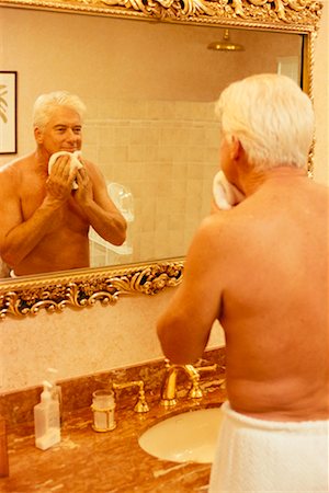 simsearch:700-00199902,k - Mature Man Wrapped in Towel in Bathroom, Looking at Reflection In Mirror Stock Photo - Rights-Managed, Code: 700-00084231