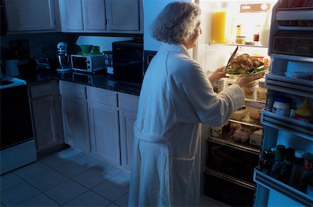 simsearch:700-00077881,k - Mature Woman Standing at Fridge Having Chicken as Midnight Snack Stock Photo - Rights-Managed, Code: 700-00084258