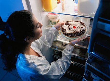 Woman Standing at Fridge, Having Pie as Midnight Snack Stock Photo - Rights-Managed, Code: 700-00084380