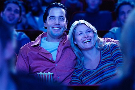 Couple Watching Movie in Theatre Laughing Stock Photo - Rights-Managed, Code: 700-00084508