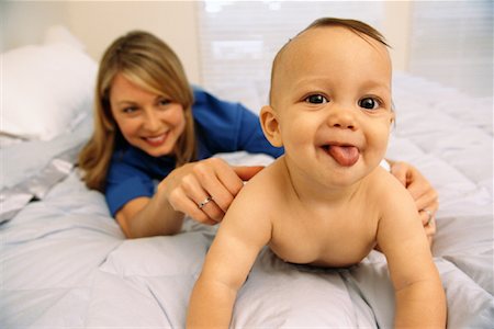 Portrait of Mother and Baby on Bed Stock Photo - Rights-Managed, Code: 700-00084518