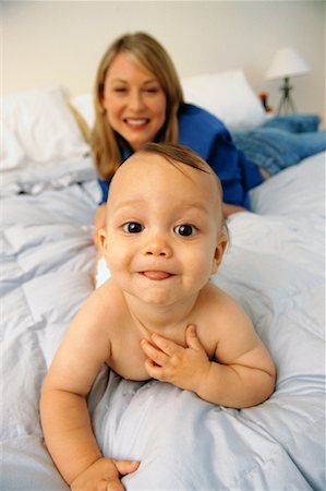 Portrait of Mother and Baby on Bed Stock Photo - Rights-Managed, Code: 700-00084519