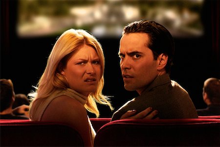 Portrait of Angry Couple in Movie Theater Stock Photo - Rights-Managed, Code: 700-00085004