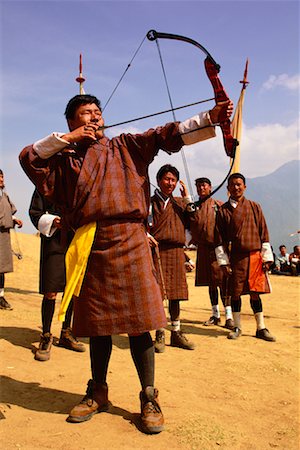 Men in Archery Competition at Gasello, Wangdue Phodrang Valley Bhutan Stock Photo - Rights-Managed, Code: 700-00085139