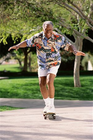Portrait of Mature Man Skateboarding Stock Photo - Rights-Managed, Code: 700-00085255