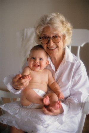 Portrait of Grandmother Sitting In Chair, Holding Grandchild Foto de stock - Con derechos protegidos, Código: 700-00085383