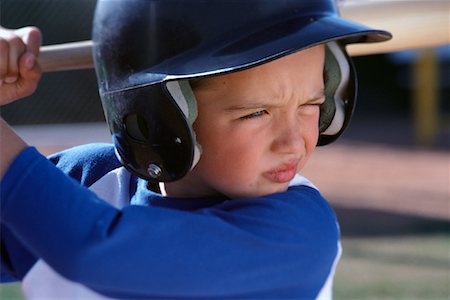 Boy Wearing Baseball Uniform and Helmet, Batting Stock Photo - Rights-Managed, Code: 700-00085412