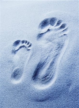 Close-Up of Large and Small Footprints in Sand Stock Photo - Rights-Managed, Code: 700-00085705