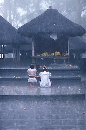 Back View of People Praying at Temple in Rain Kintamani, Bali, Indonesia Stock Photo - Rights-Managed, Code: 700-00085801