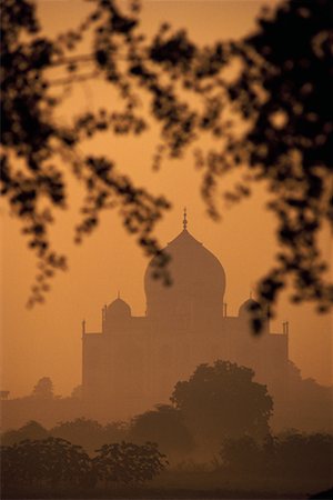 sunrise taj mahal - Silhouette of Taj Mahal in Haze At Sunset Agra, India Stock Photo - Rights-Managed, Code: 700-00085959