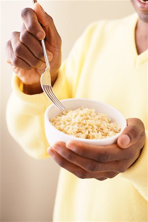 Hands Holding Bowl of Rice and Fork Stock Photo - Rights-Managed, Code: 700-00086025