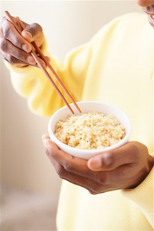 Hands Holding Bowl of Rice and Chopsticks Stock Photo - Rights-Managed, Code: 700-00086026