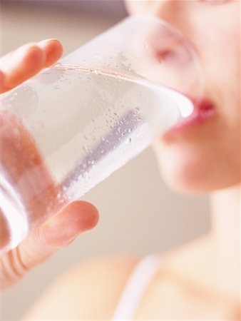 satisfied (thirst) - Close-Up of Woman Drinking Glass Of Water Foto de stock - Con derechos protegidos, Código: 700-00086038