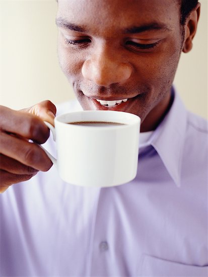 Close-Up of Man Drinking Cup of Coffee Stock Photo - Premium Rights-Managed, Artist: Michael Alberstat, Image code: 700-00086076