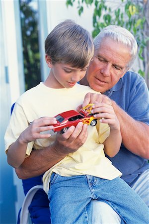 simsearch:700-00086253,k - Grandfather and Grandson Playing With Model Hot-Rod Outdoors Stock Photo - Rights-Managed, Code: 700-00086256