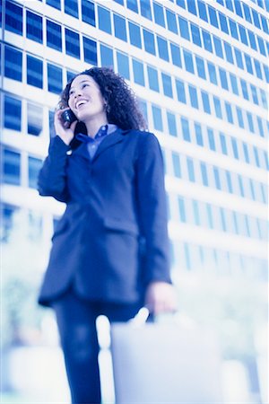 simsearch:700-00071171,k - Businesswoman Standing Outdoors Using Cell Phone Fotografie stock - Rights-Managed, Codice: 700-00086272