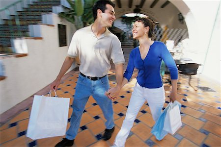 simsearch:700-00086311,k - Couple Walking Outdoors, Carrying Shopping Bags Stock Photo - Rights-Managed, Code: 700-00086307