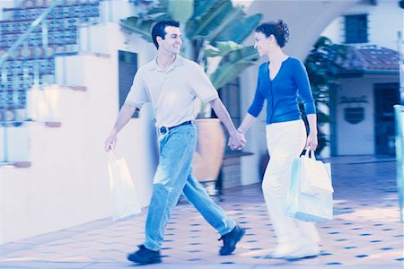 simsearch:700-00086311,k - Couple Walking Outdoors, Carrying Shopping Bags Stock Photo - Rights-Managed, Code: 700-00086308