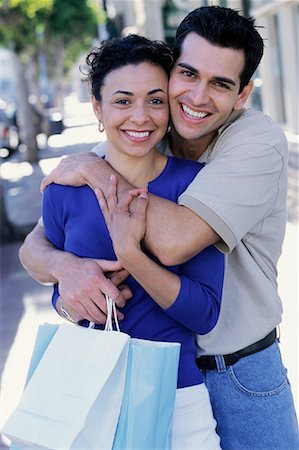 simsearch:700-00086310,k - Portrait of Couple Embracing and Holding Shopping Bags Outdoors Stock Photo - Rights-Managed, Code: 700-00086303