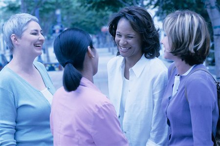 simsearch:700-00086329,k - Four Women Standing Outdoors Laughing Stock Photo - Rights-Managed, Code: 700-00086327