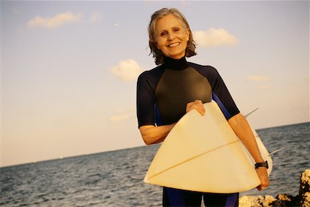 simsearch:700-00513787,k - Woman Carrying Surfboard Stock Photo - Rights-Managed, Code: 700-00087333