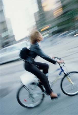 riding bike blur city - Woman on Bike Stock Photo - Rights-Managed, Code: 700-00087603